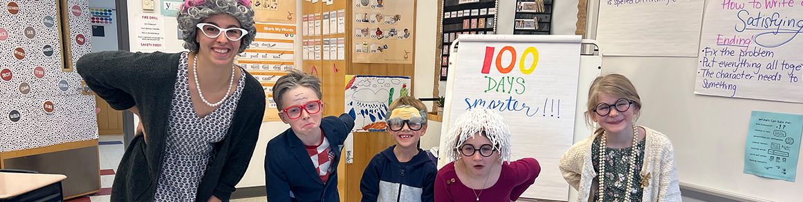 Teacher with group of students dressed up as old people